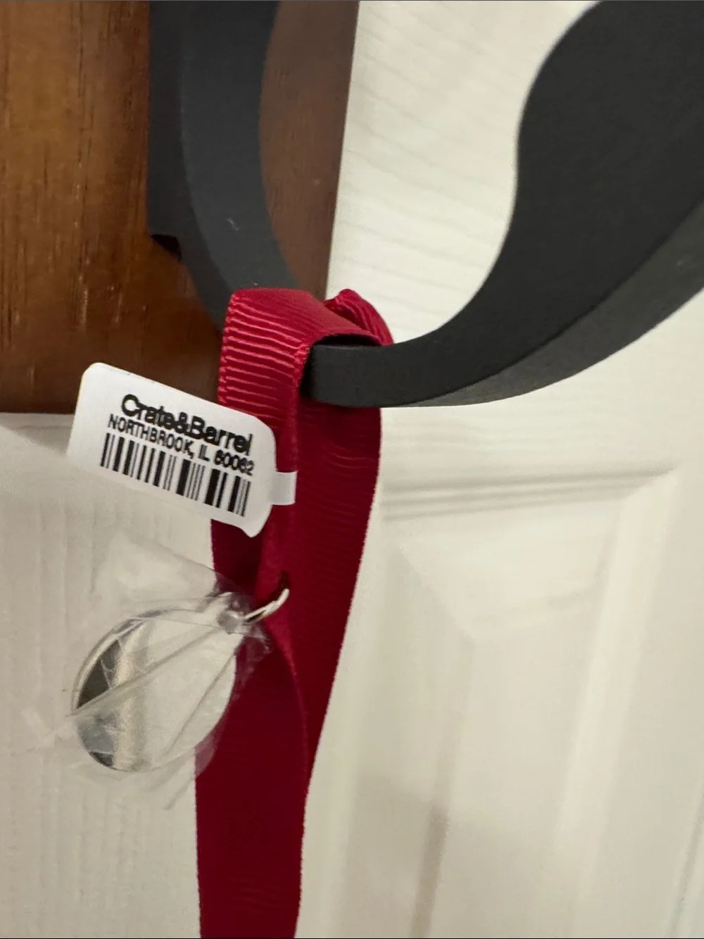 Crate&Barrel Silver Paw Ornament with Red Ribbon